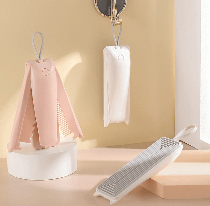 Three-in-one pet hair remover in pink and white, designed for effective grooming and easy storage.