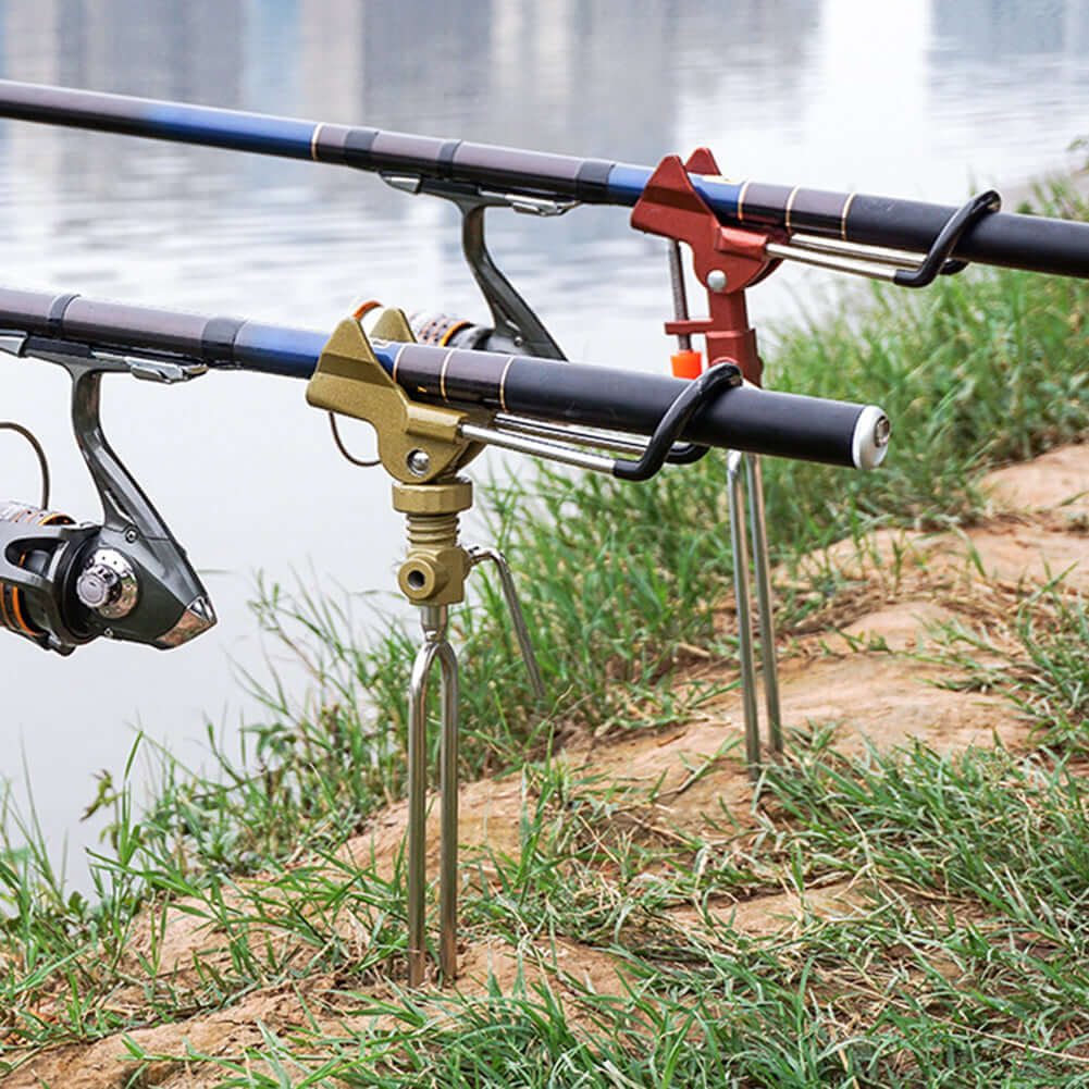 Stainless steel fishing rod holders on the bank of a river, showcasing adjustable sensitivity and durable design.