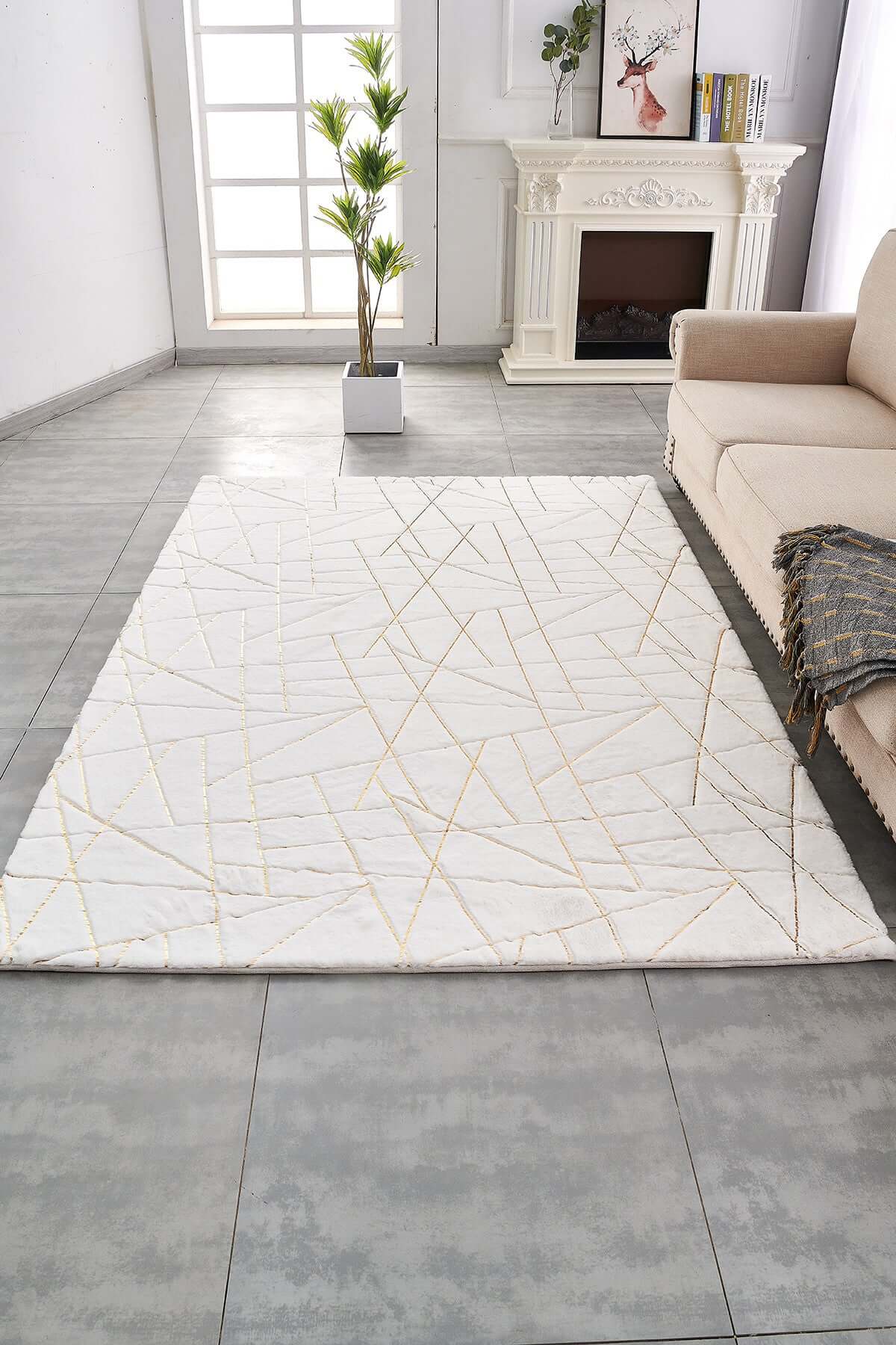 3' x 5' white and gold faux fur abstract shag area rug adding texture and style to a modern living room.