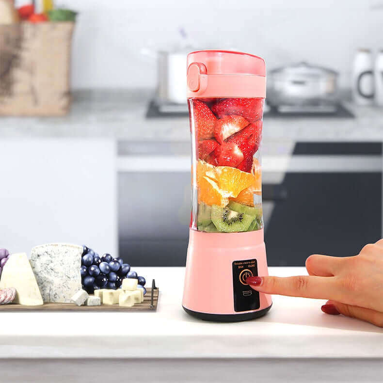 Portable electric fruit juicer with fresh fruits, designed for smoothies and shakes, USB rechargeable and easy to use.