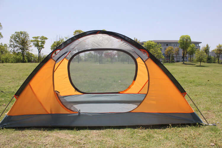Outdoor double camping tent with mesh window, designed for rainproof and lightweight durability in nature.